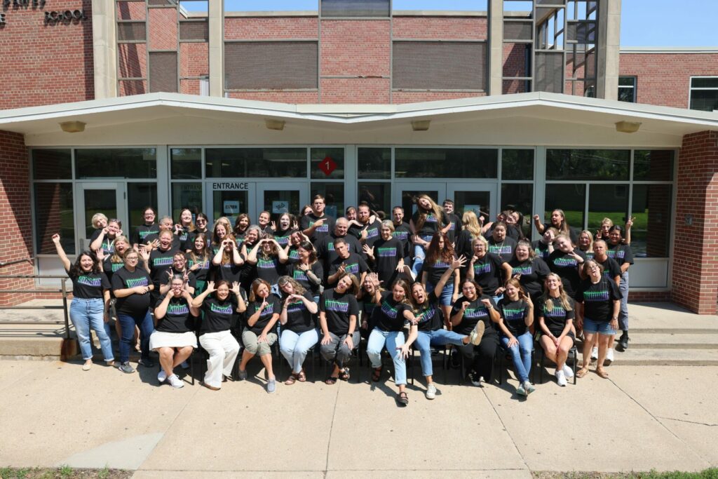 Photo of Dawes staff outside the building's front door